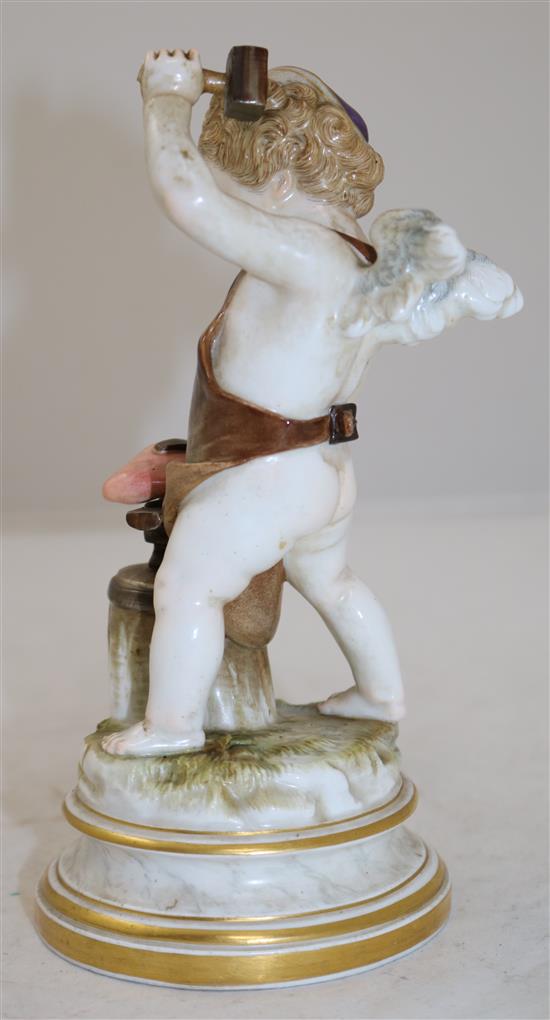 A Meissen porcelain figure of cupid depicted as a blacksmith forging a heart, 18.5cm